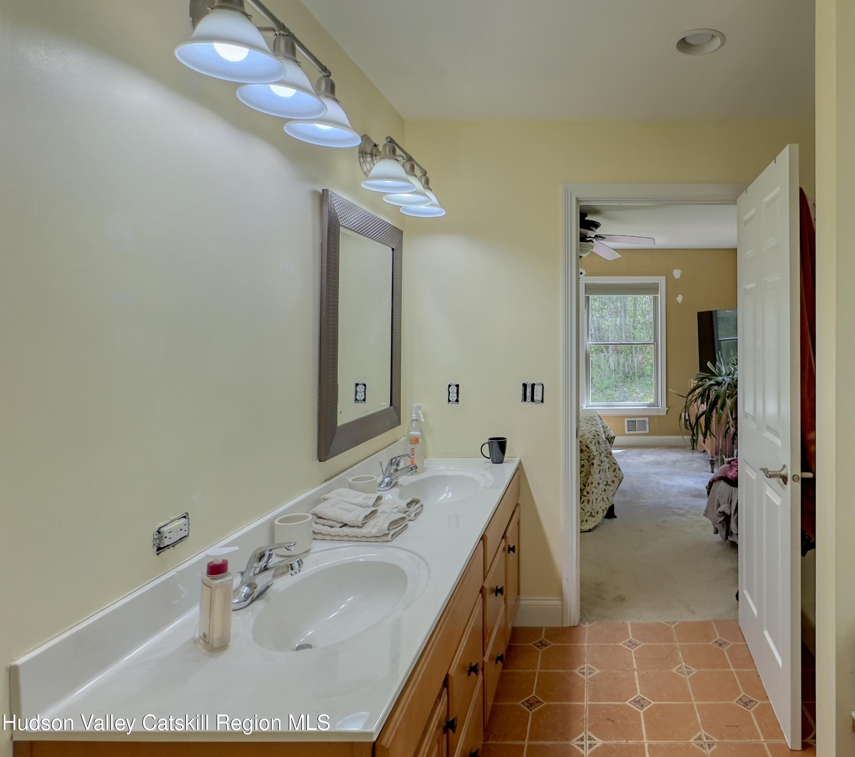 996 Sleepy Hollow Road Athens, NY 12015 - Photo 14 of 32 a en suite bathroom with a granite countertop sink and a mirror
