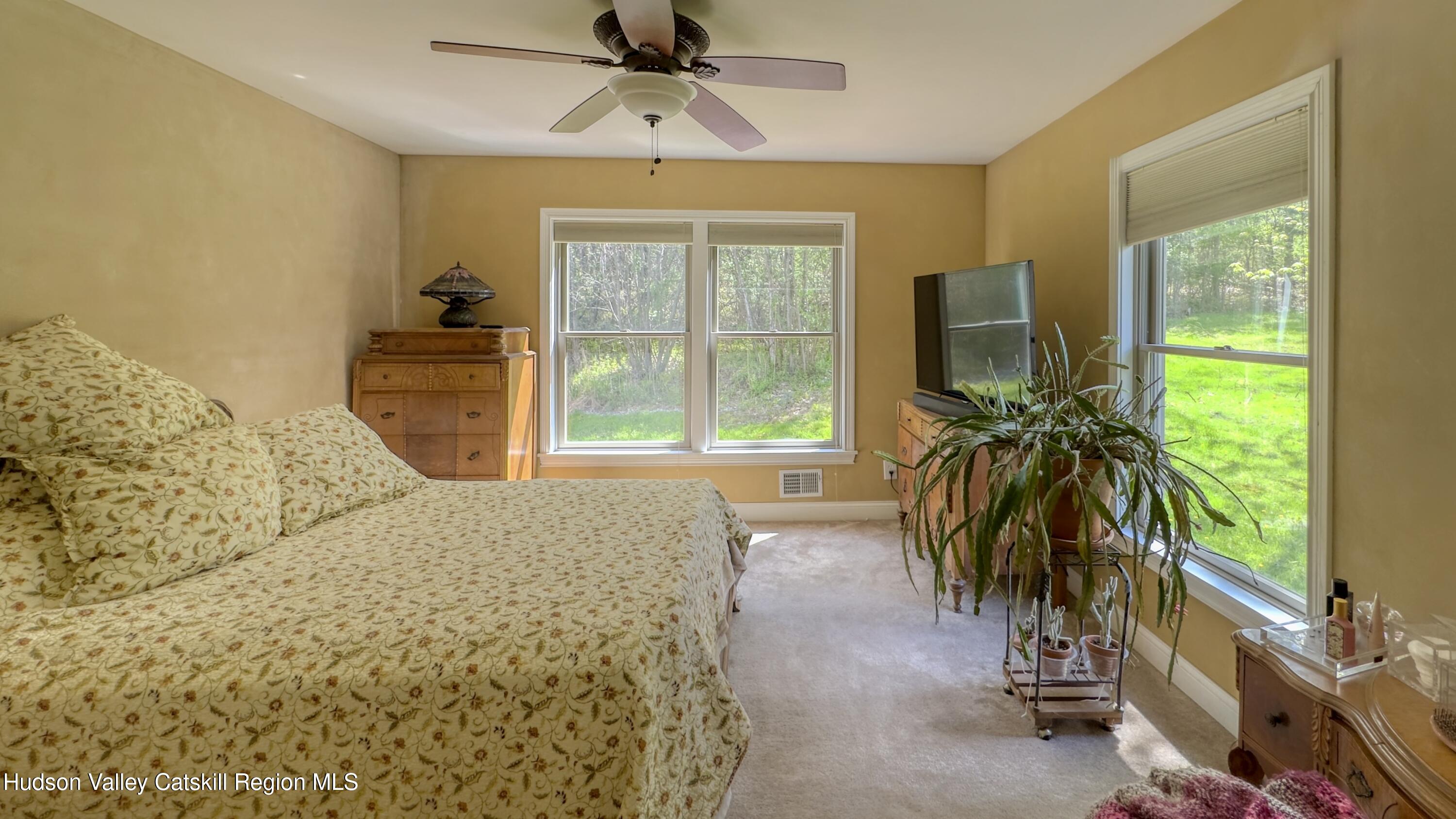 996 Sleepy Hollow Road Athens, NY 12015 - Photo 15 of 32 a bedroom with furniture and a large window