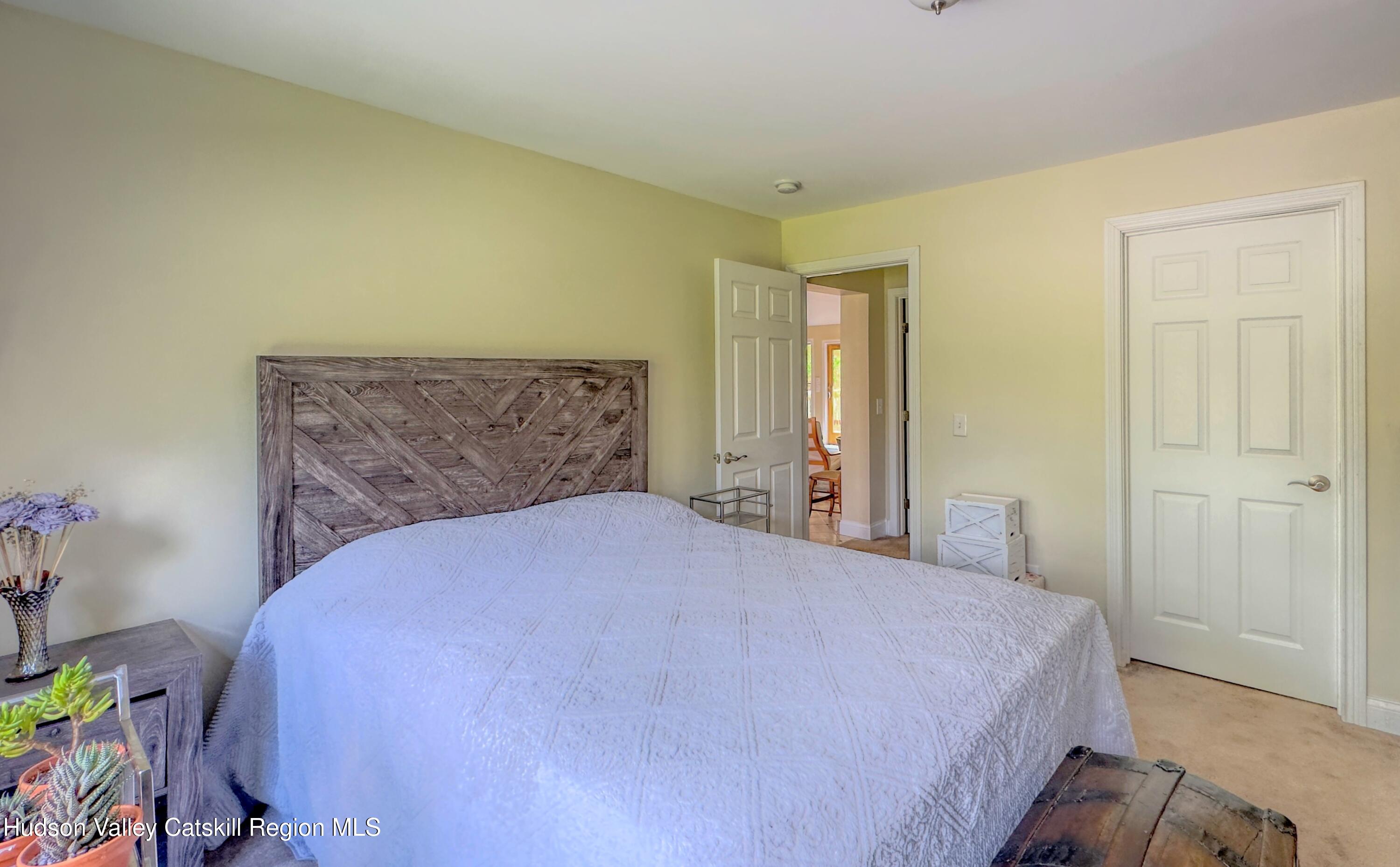 996 Sleepy Hollow Road Athens, NY 12015 - Photo 19 of 32 a bedroom with a bed and a window