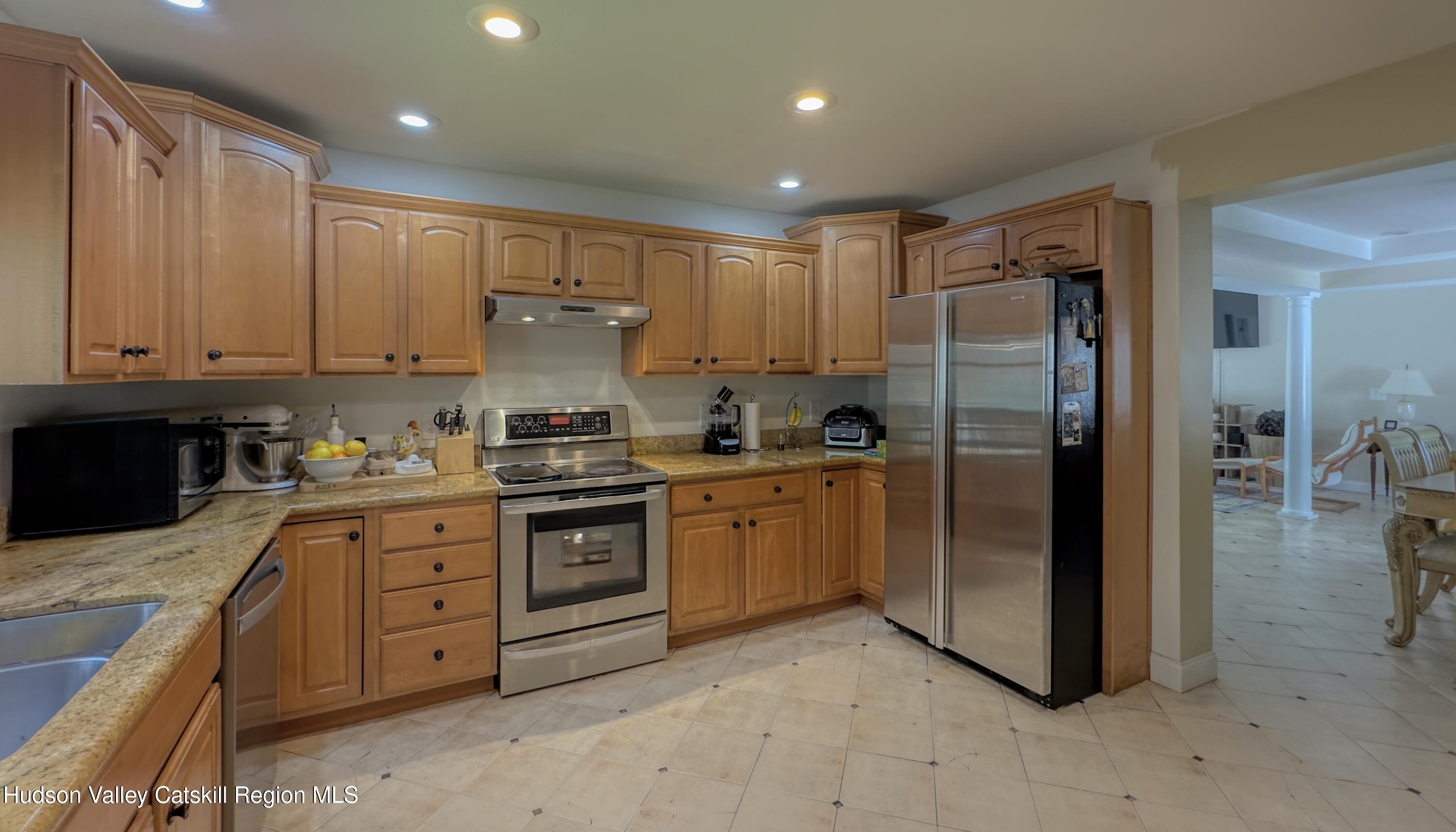 996 Sleepy Hollow Road Athens, NY 12015 - Photo 22 of 32 a kitchen with stainless steel appliances granite countertop a refrigerator and a stove top oven