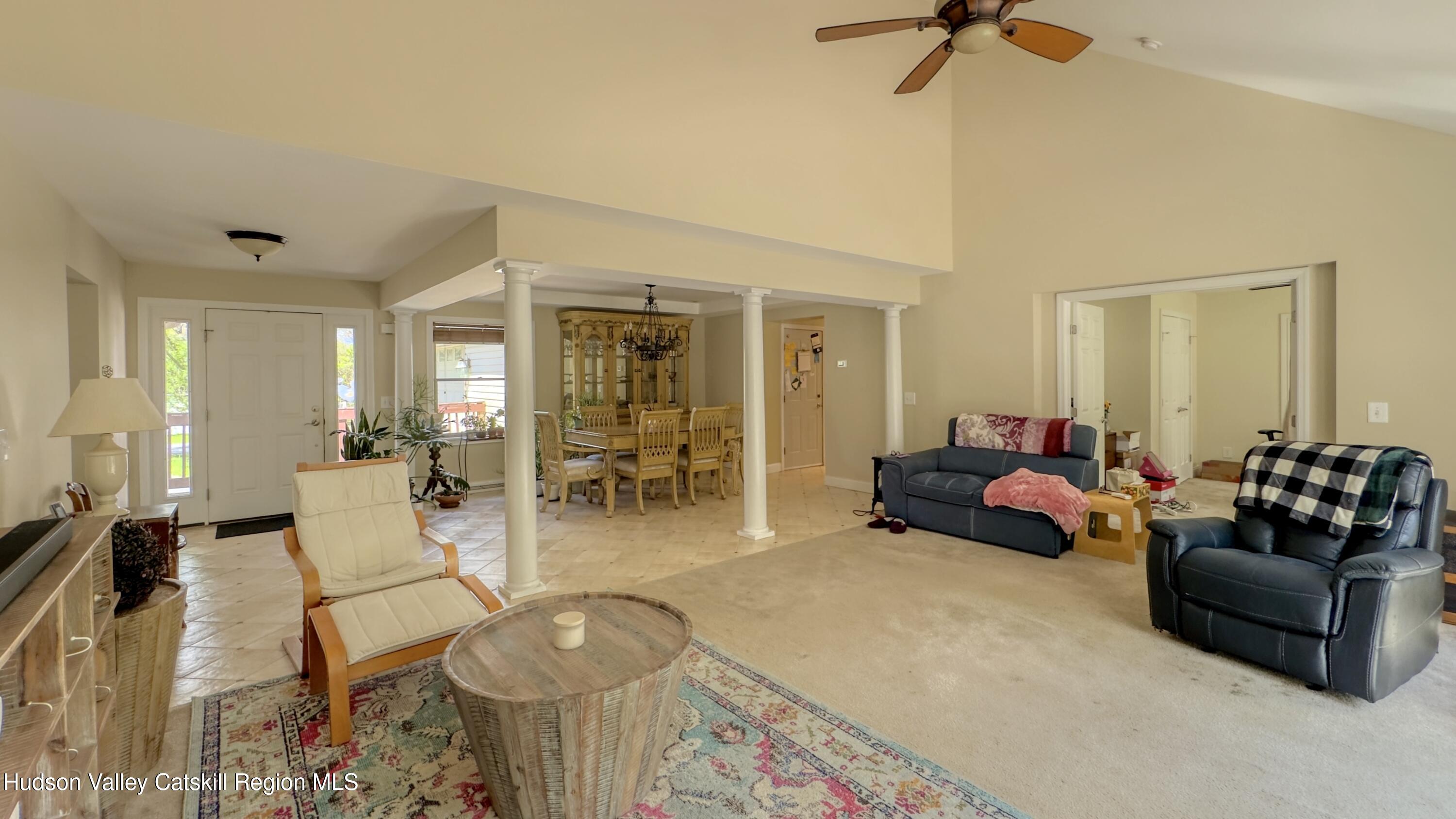 996 Sleepy Hollow Road Athens, NY 12015 - Photo 8 of 32 a living room with furniture and a chandelier