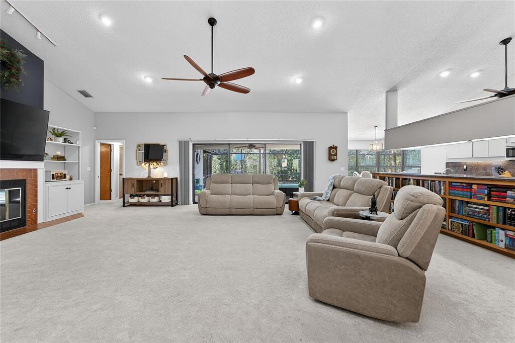 23 Chinkapin Circle Homosassa, FL 34446 - Photo 12 of 69 a living room with furniture and a flat screen tv
