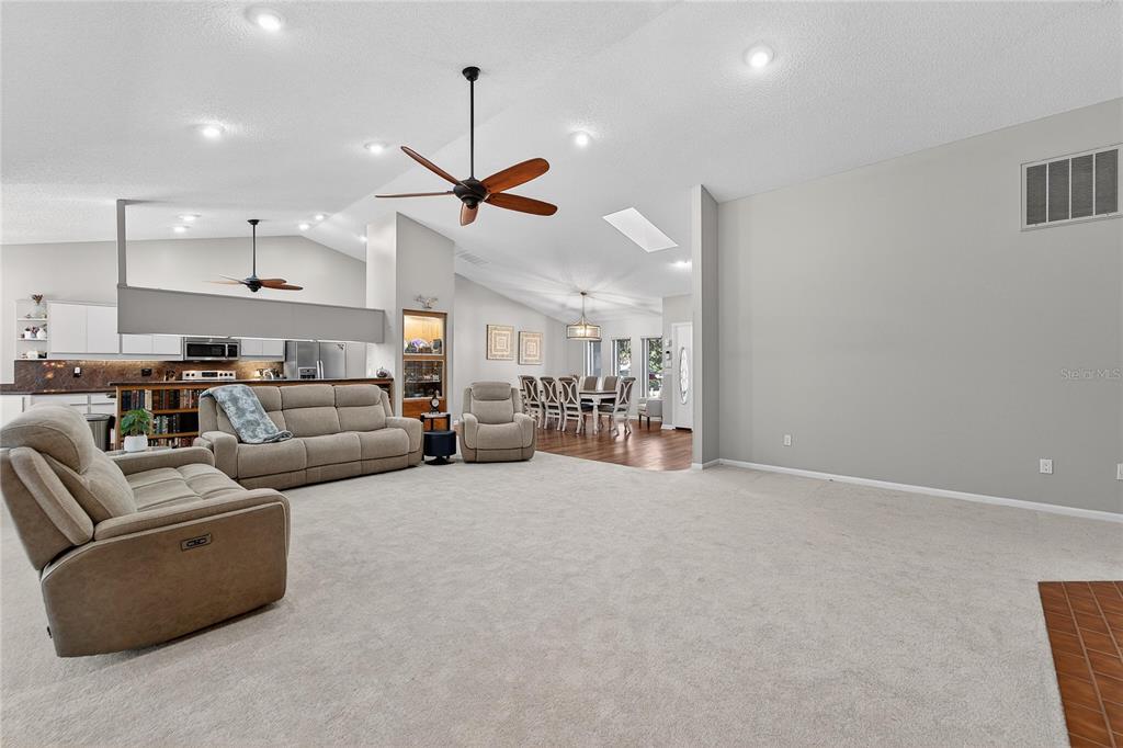 23 Chinkapin Circle Homosassa, FL 34446 - Photo 14 of 69 a living room with furniture and a ceiling fan
