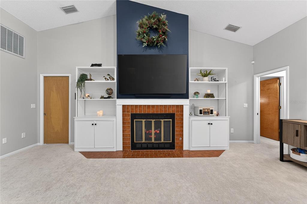 23 Chinkapin Circle Homosassa, FL 34446 - Photo 17 of 69 a living room with furniture and a fireplace