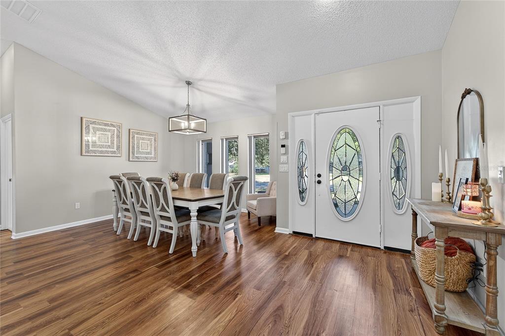23 Chinkapin Circle Homosassa, FL 34446 - Photo 18 of 69 a view of a dining room with furniture and wooden floor