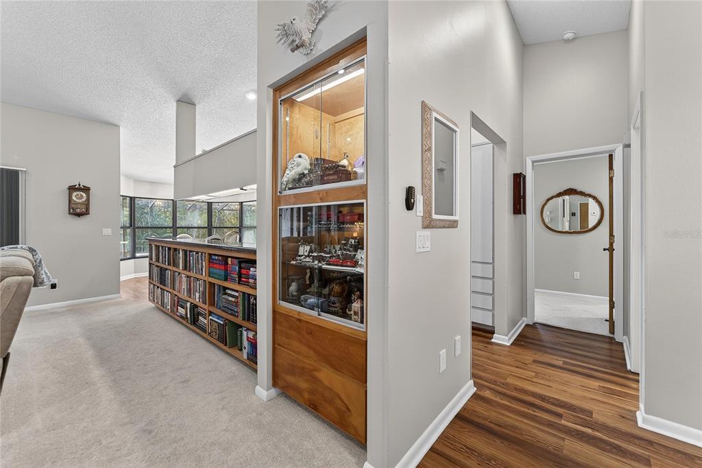 23 Chinkapin Circle Homosassa, FL 34446 - Photo 28 of 69 a room with lots of books and a large window