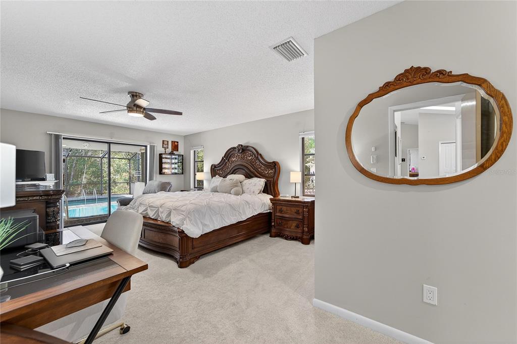 23 Chinkapin Circle Homosassa, FL 34446 - Photo 30 of 69 a bed sitting in a room next to a window and a flat screen tv