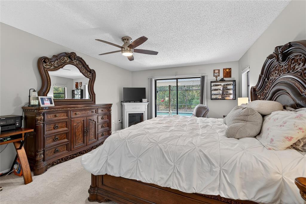23 Chinkapin Circle Homosassa, FL 34446 - Photo 32 of 69 a bedroom with a large bed and a dresser