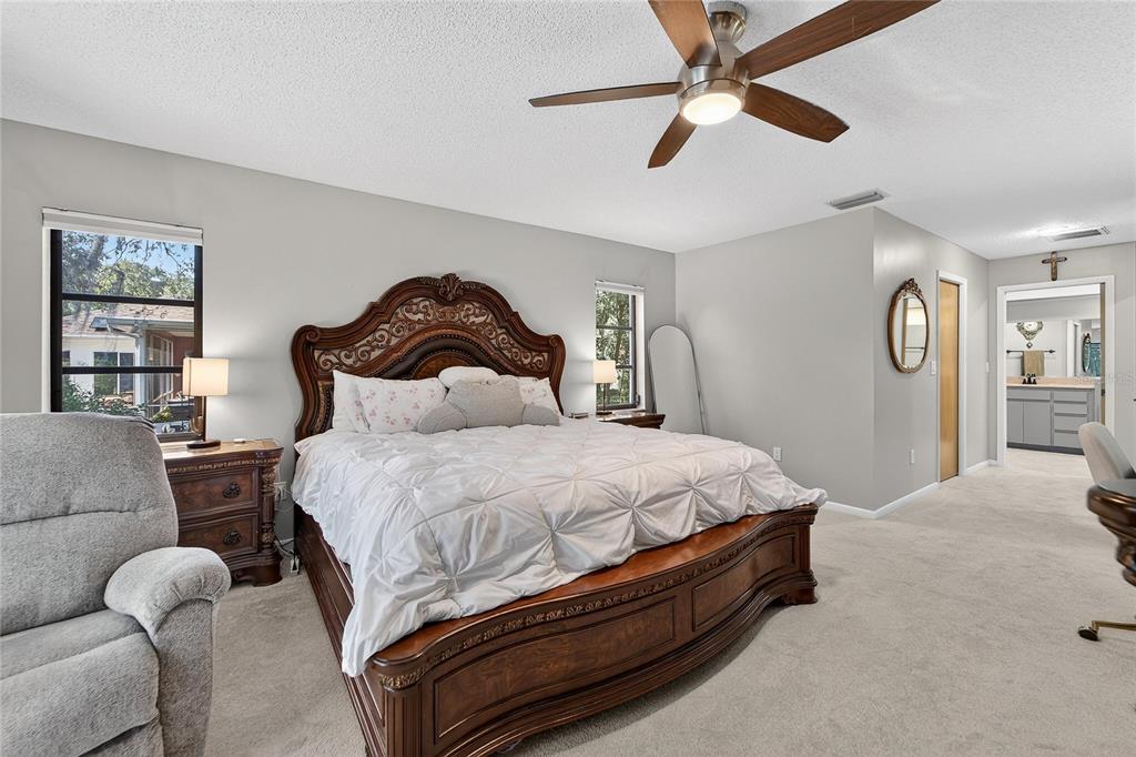 23 Chinkapin Circle Homosassa, FL 34446 - Photo 33 of 69 a bed room with a bed and a chandelier
