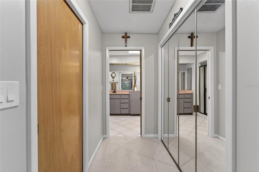 23 Chinkapin Circle Homosassa, FL 34446 - Photo 34 of 69 a view of a hallway with wooden floor and a bathroom