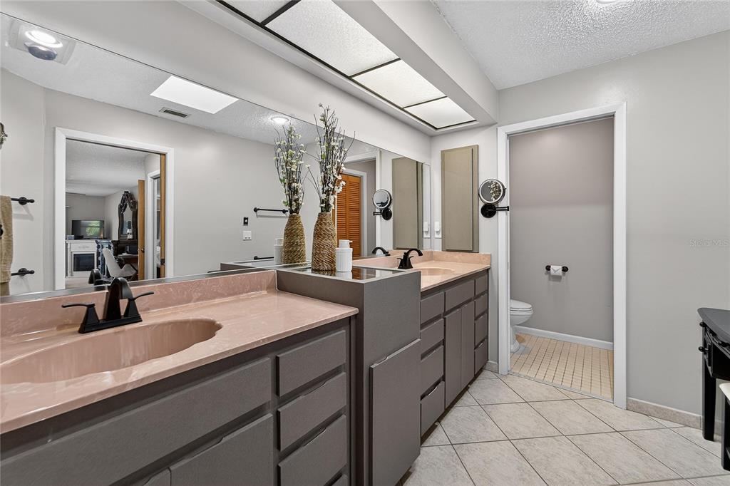 23 Chinkapin Circle Homosassa, FL 34446 - Photo 37 of 69 a bathroom with a sink double vanity and a mirror