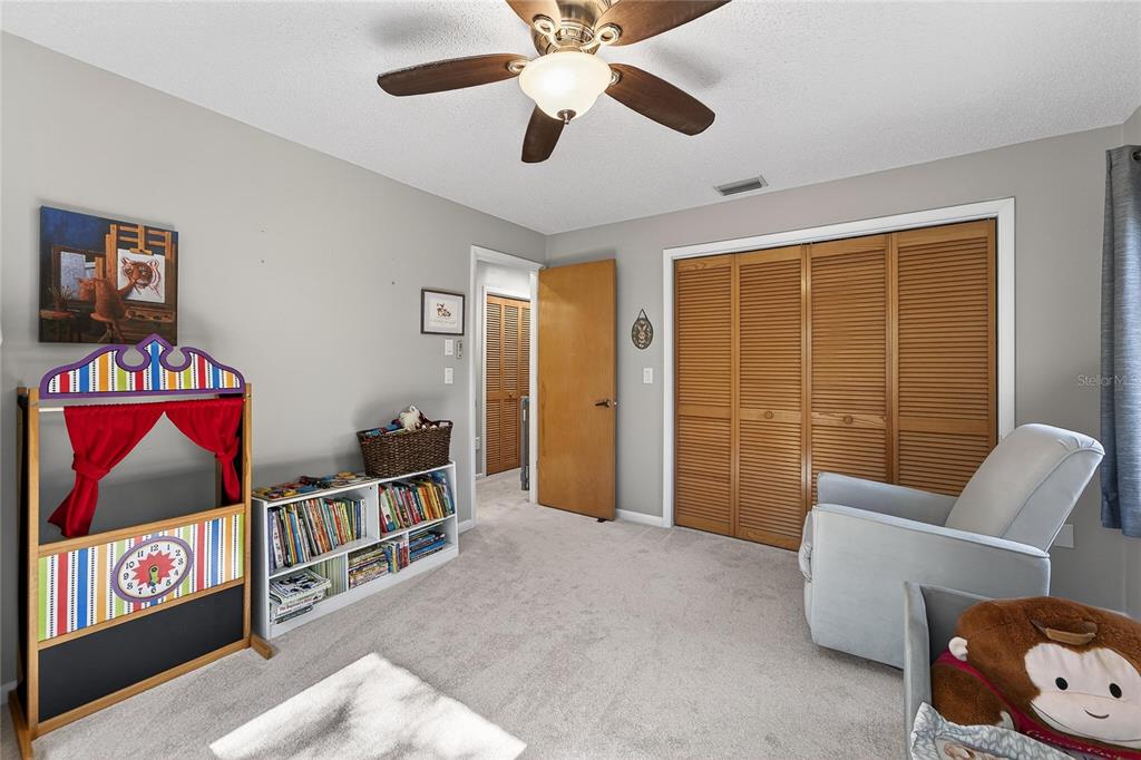 23 Chinkapin Circle Homosassa, FL 34446 - Photo 45 of 69 a view of an empty room with furniture and a ceiling fan