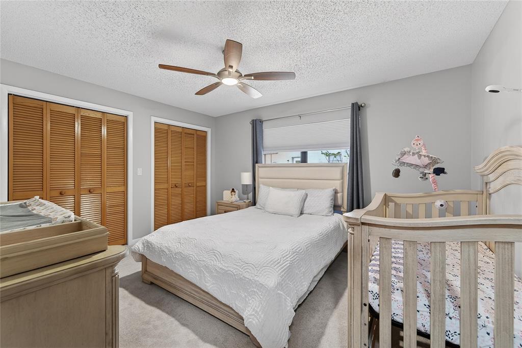 23 Chinkapin Circle Homosassa, FL 34446 - Photo 46 of 69 a bedroom with a bed and a chandelier