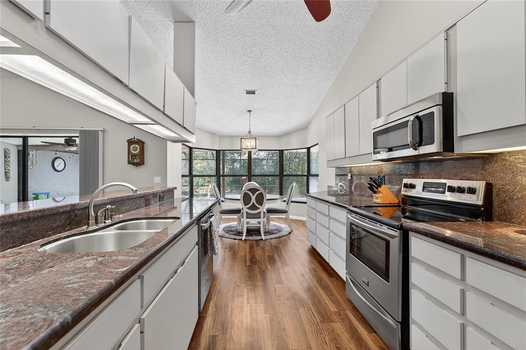 23 Chinkapin Circle Homosassa, FL 34446 - Photo 5 of 69 a kitchen with stainless steel appliances granite countertop a sink and stove
