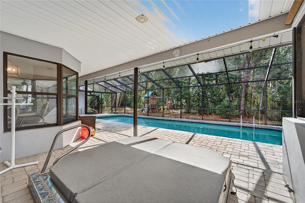 23 Chinkapin Circle Homosassa, FL 34446 - Photo 52 of 69 a living room with a large window and table