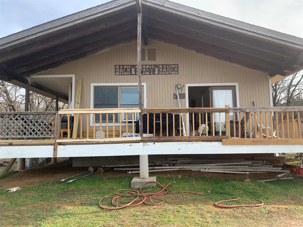 8381 Salt Creek Road Jacksboro, TX 76458 - Photo 6 of 37 a view of a house with swimming pool