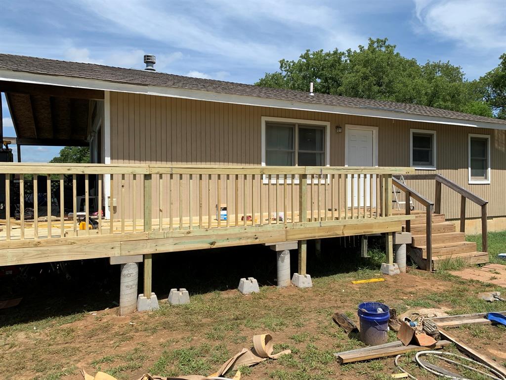 8381 Salt Creek Road Jacksboro, TX 76458 - Photo 7 of 37 a balcony with table and chairs