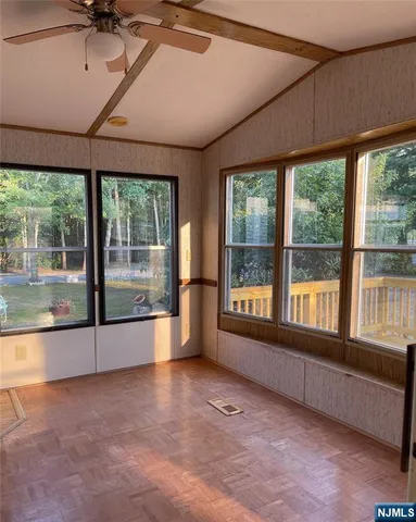 a view of an empty room with a large window