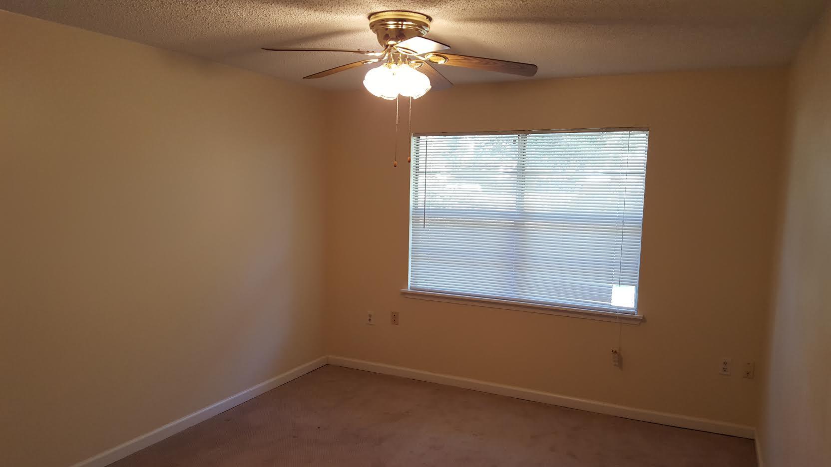 609 Colonial Drive, Unit 2 Fort Walton Beach, FL 32547 - Photo 12 of 17 an empty room with a window and a fan