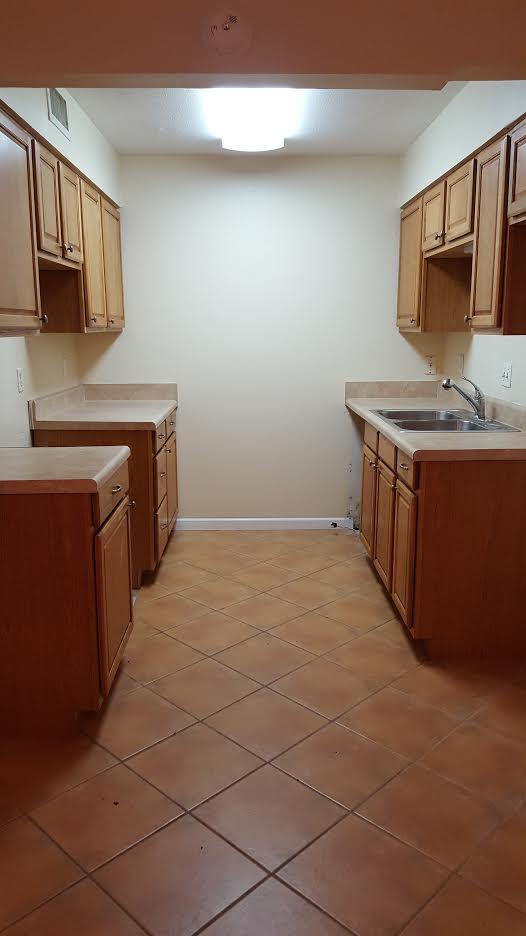 609 Colonial Drive, Unit 2 Fort Walton Beach, FL 32547 - Photo 5 of 17 a kitchen with stainless steel appliances a sink stove and microwave
