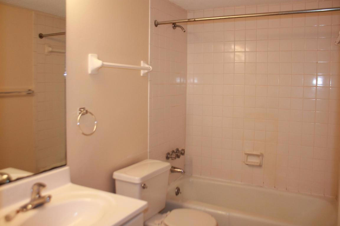 609 Colonial Drive, Unit 2 Fort Walton Beach, FL 32547 - Photo 8 of 17 a bathroom with a shower and a toilet