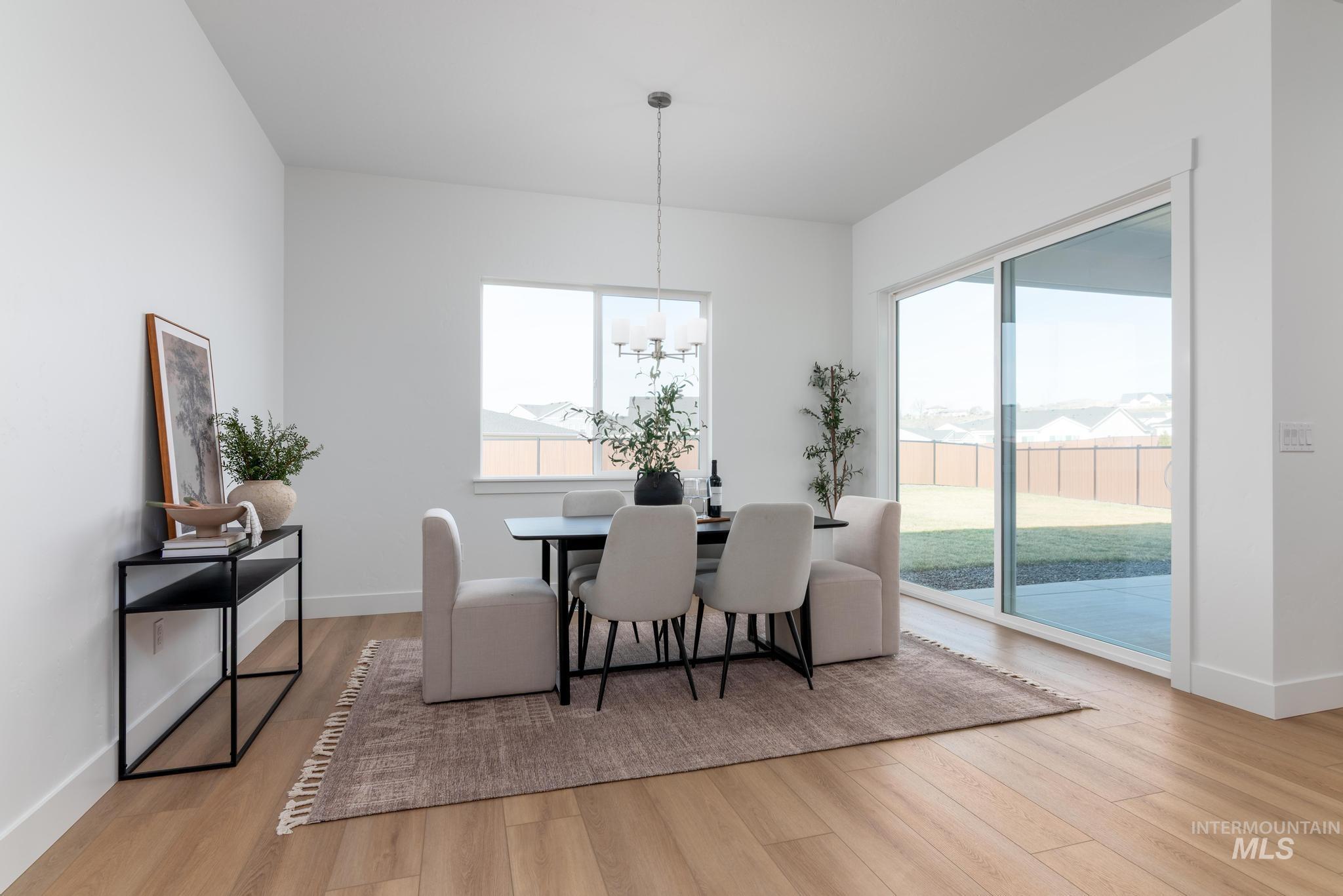 3612 North Pindall Way Star, ID 83669 - Photo 6 of 12 Dining room with hanging lights and light wood-style flooring
