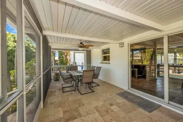 a view of a patio with wooden floor
