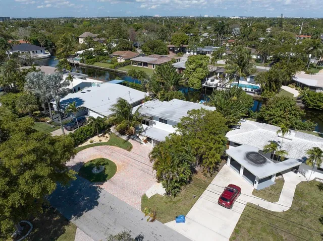 an aerial view of a house with a lake view