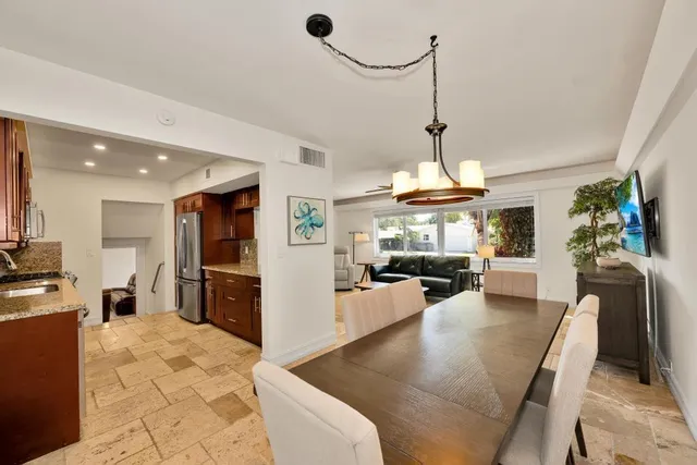 a view of a living room and kitchen