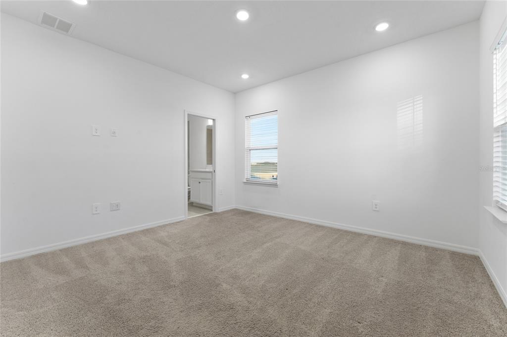 2834 High Pointe Circle Clermont, FL 34711 - Photo 19 of 39 an empty room with windows