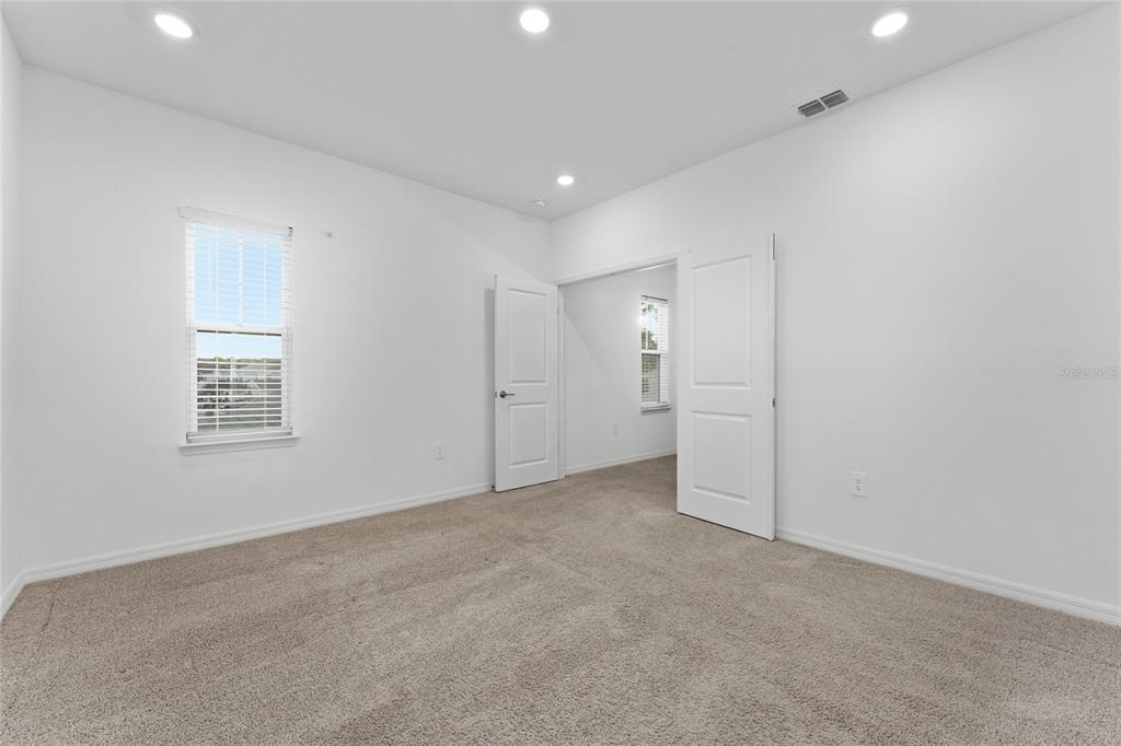 2834 High Pointe Circle Clermont, FL 34711 - Photo 20 of 39 an empty room with a empty space and windows