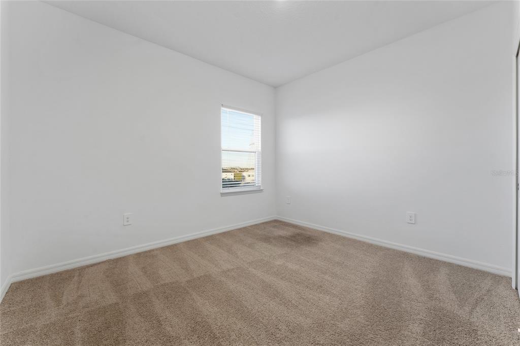 2834 High Pointe Circle Clermont, FL 34711 - Photo 22 of 39 an empty room with windows