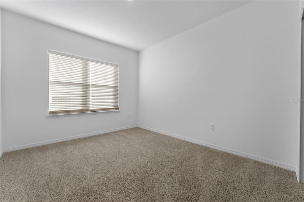 2834 High Pointe Circle Clermont, FL 34711 - Photo 24 of 39 an empty room with windows