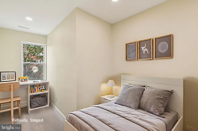 a bedroom with a bed and a window