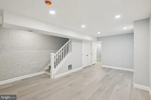 a view of a balcony with wooden floor