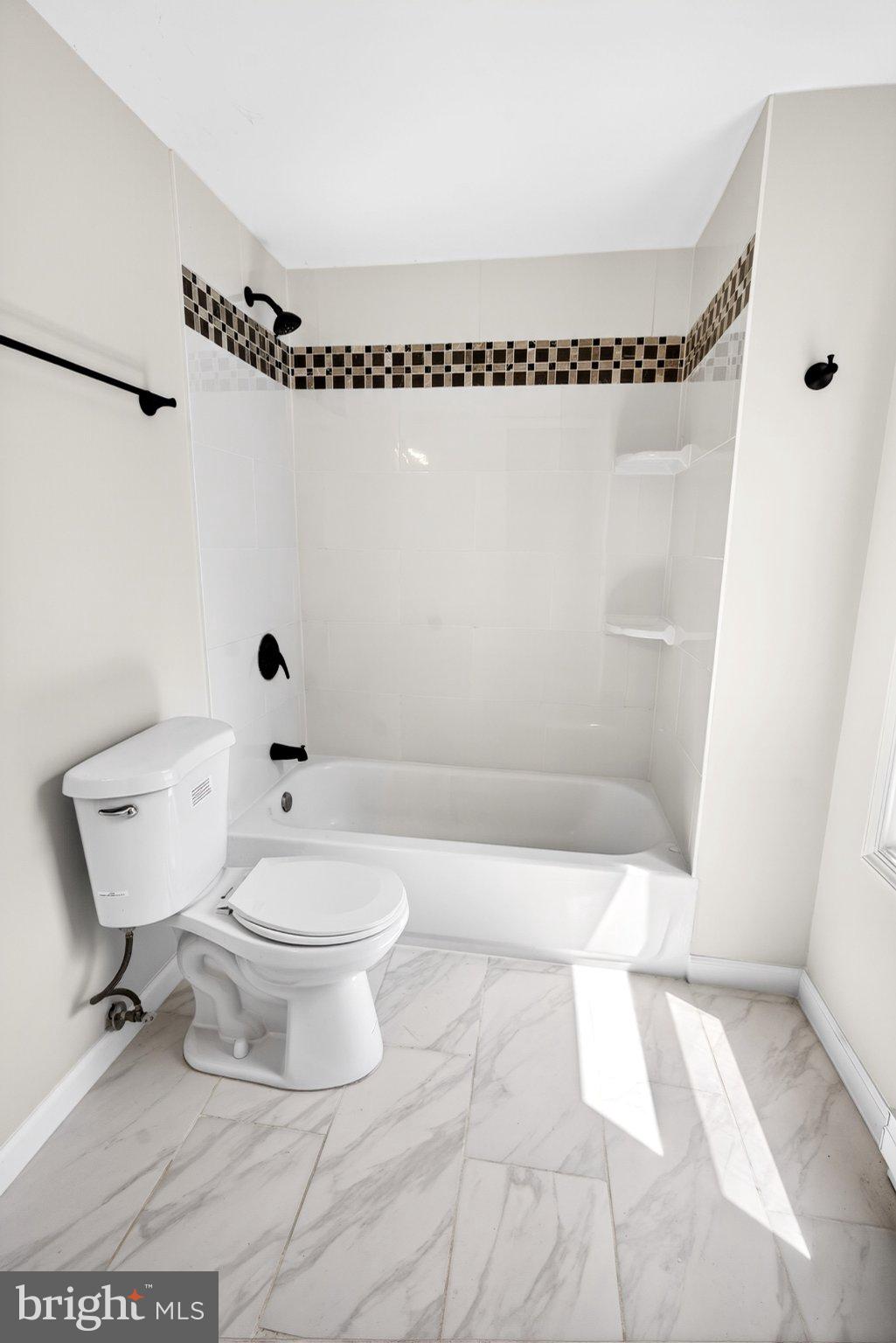 9081 Dumhart Road Laurel, MD 20723 - Photo 28 of 45 Modern bathroom with elegant tiles.