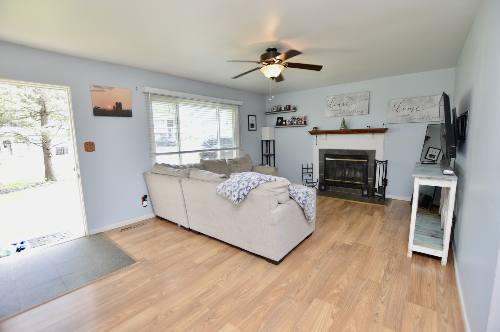 3206 Hunter Path McHenry, IL 60050 - Photo 5 of 13 a living room with furniture and a fireplace
