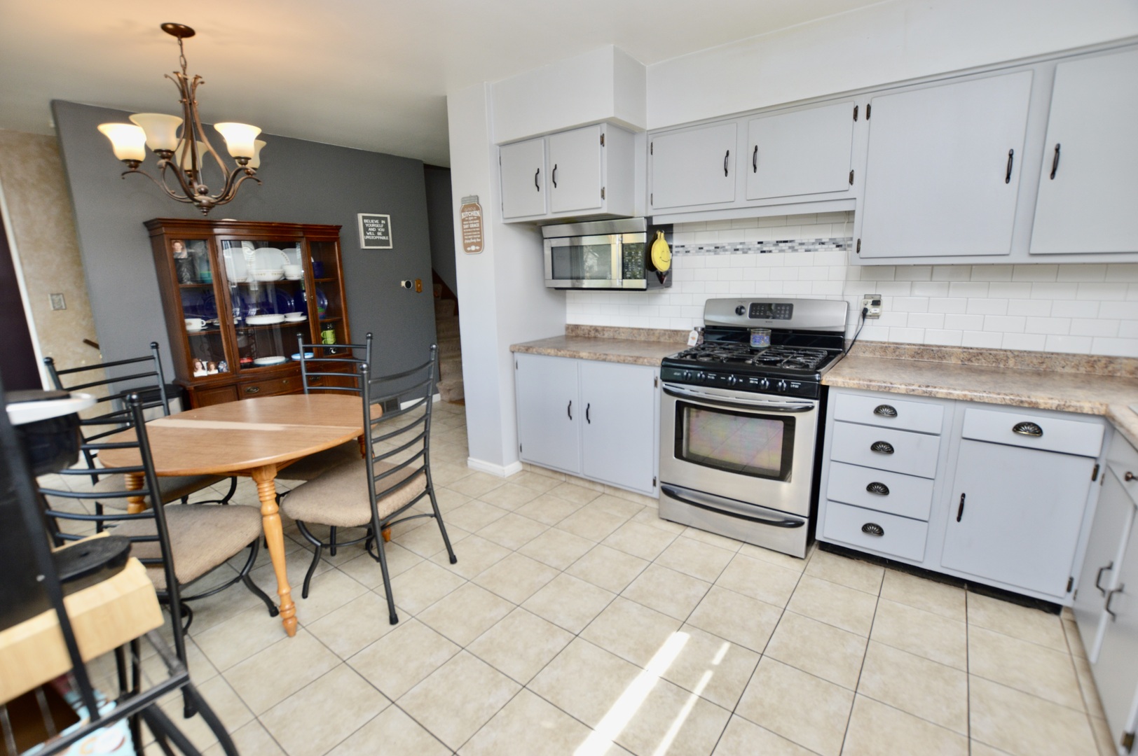 3206 Hunter Path McHenry, IL 60050 - Photo 6 of 13 a kitchen with stainless steel appliances a stove a sink and cabinets