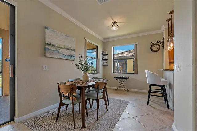 a living room with furniture and large windows