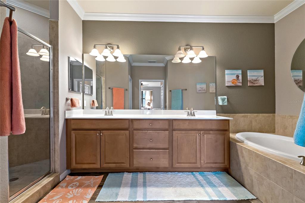 7015 Grand Estuary Trail, Unit 103 Bradenton, FL 34212 - Photo 33 of 62 a bathroom with a double vanity sink and a mirror
