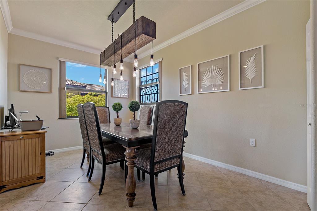 7015 Grand Estuary Trail, Unit 103 Bradenton, FL 34212 - Photo 37 of 62 a view of a dining room with furniture