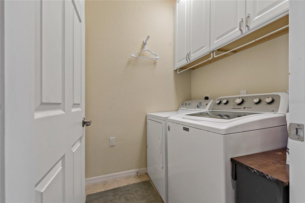 7015 Grand Estuary Trail, Unit 103 Bradenton, FL 34212 - Photo 39 of 62 a utility room with dryer and washer