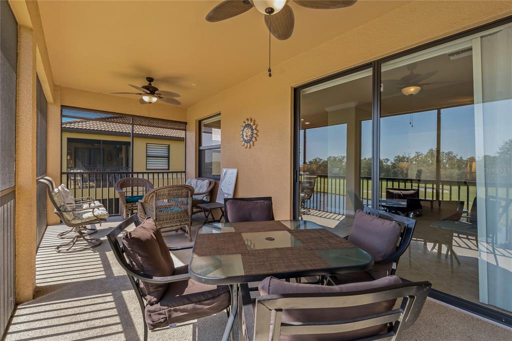 7015 Grand Estuary Trail, Unit 103 Bradenton, FL 34212 - Photo 40 of 62 a view of a dining room with furniture window and outside view