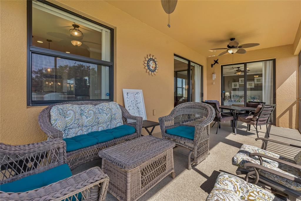 7015 Grand Estuary Trail, Unit 103 Bradenton, FL 34212 - Photo 41 of 62 a bedroom with furniture and a window