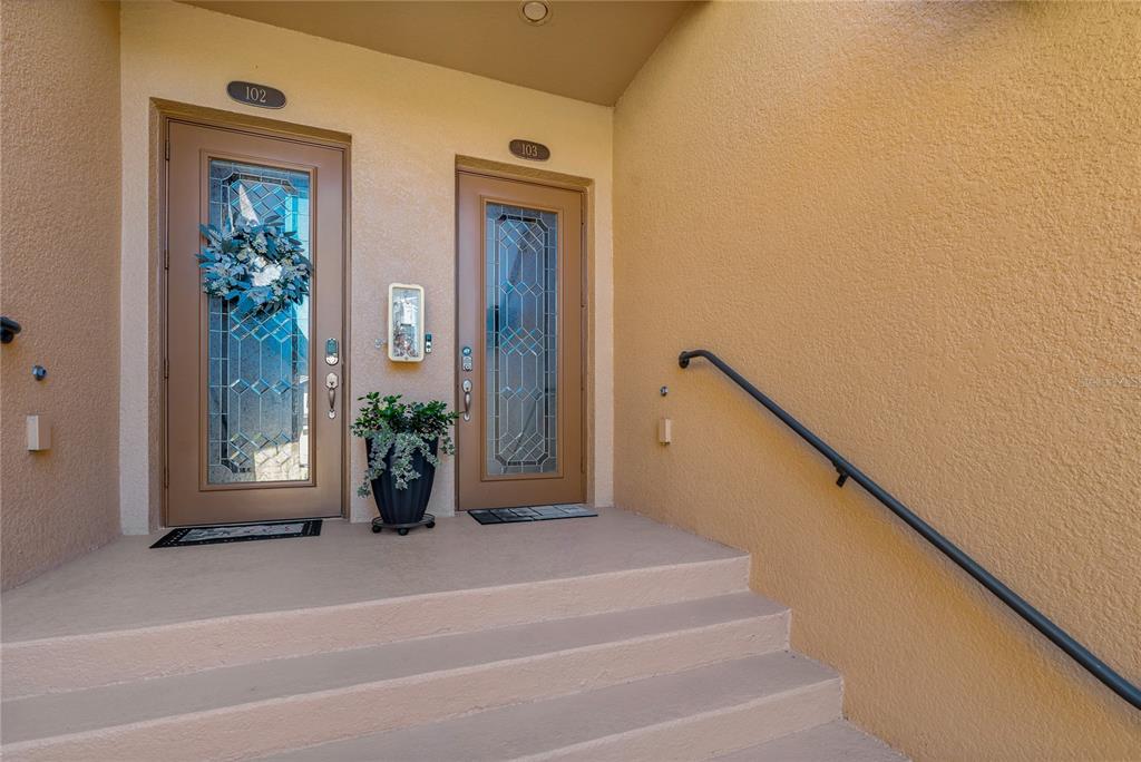 7015 Grand Estuary Trail, Unit 103 Bradenton, FL 34212 - Photo 45 of 62 a view of entryway with a front door