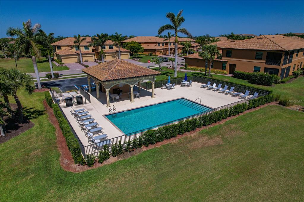 7015 Grand Estuary Trail, Unit 103 Bradenton, FL 34212 - Photo 46 of 62 a aerial view of a house with a swimming pool