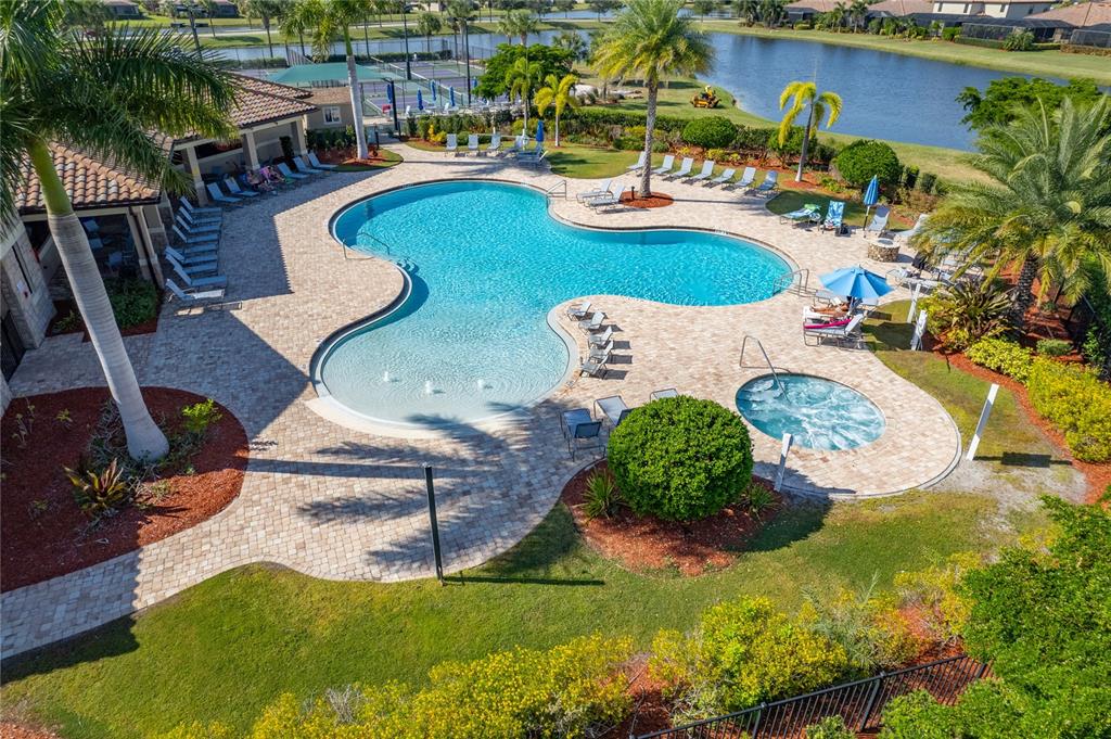 7015 Grand Estuary Trail, Unit 103 Bradenton, FL 34212 - Photo 55 of 62 swimming pool view with a garden and plants