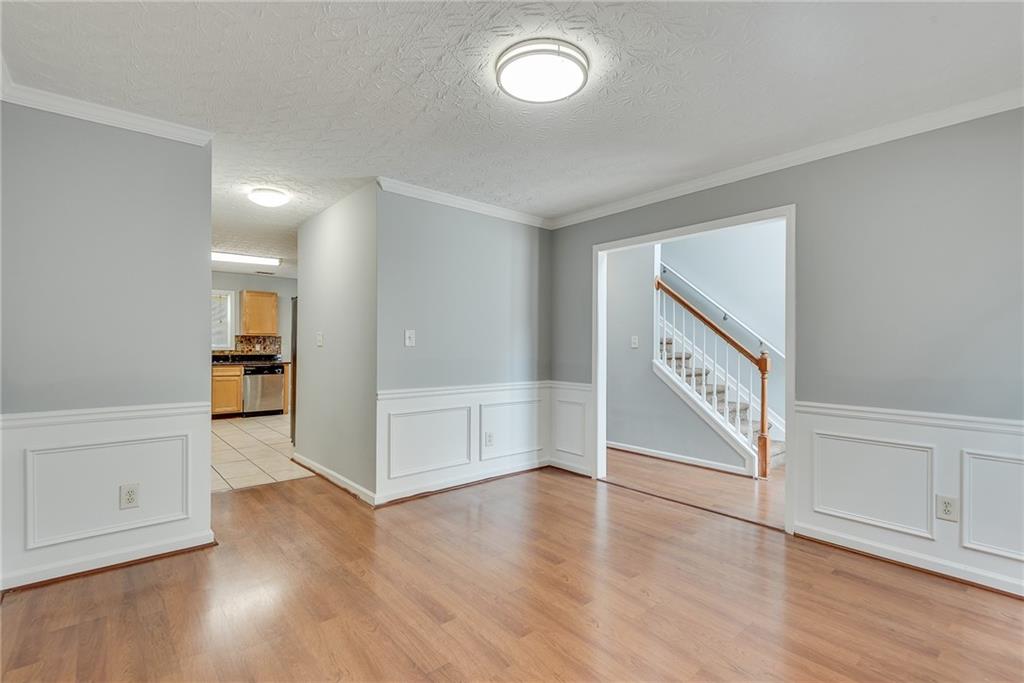 3337 Baymount Way Lawrenceville, GA 30043 - Photo 11 of 47 an empty room with wooden floor and windows