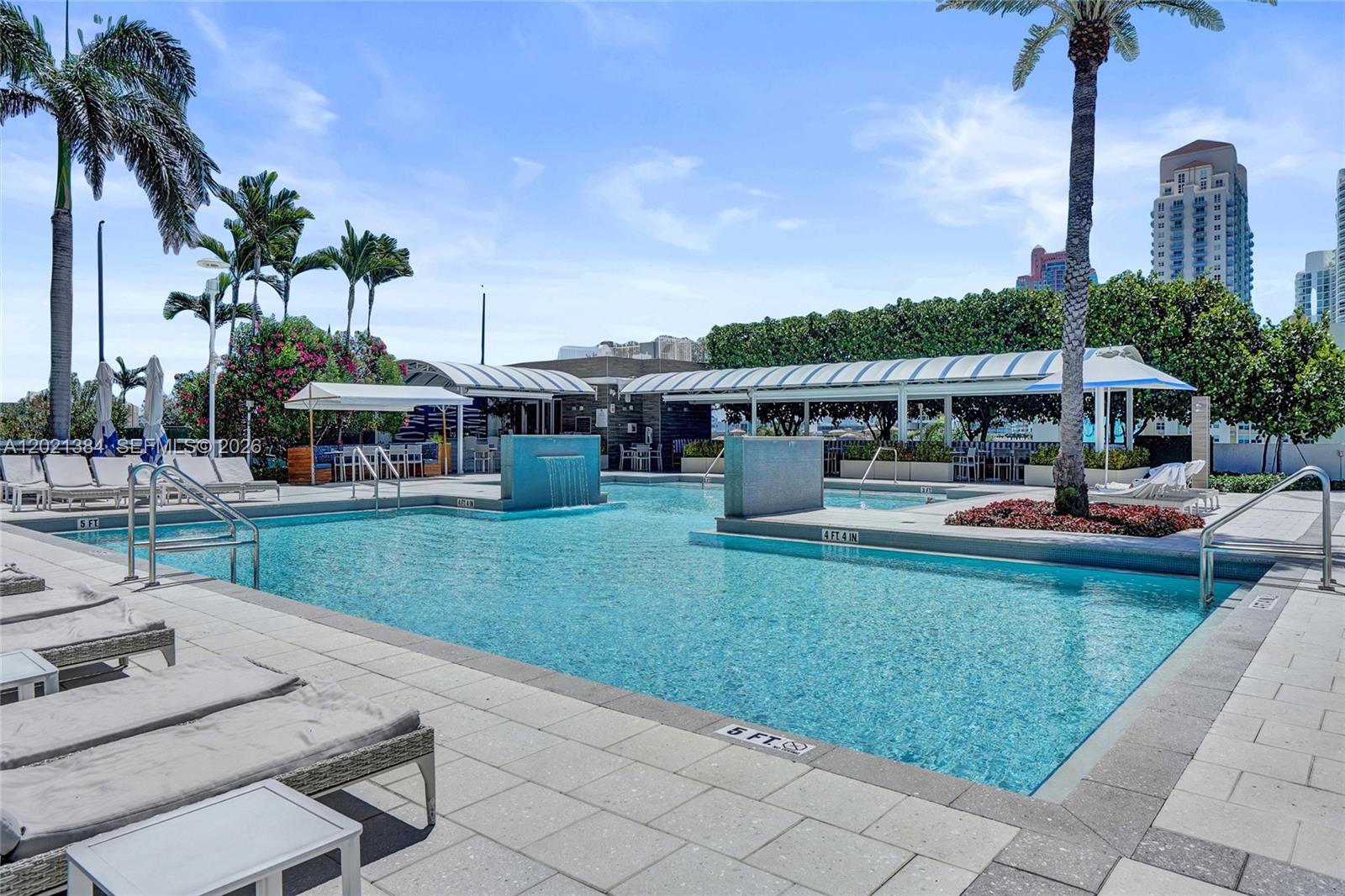 400 Alton Road, Unit PH11 Miami Beach, FL 33139 - Photo 40 of 49 a view of a house with garden and swimming pool