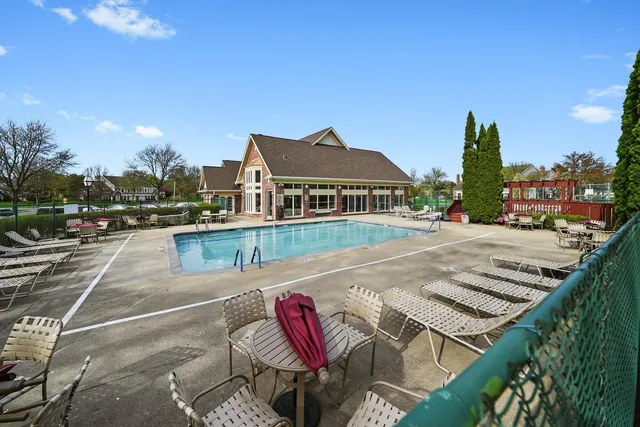 a view of a patio with a table and chairs